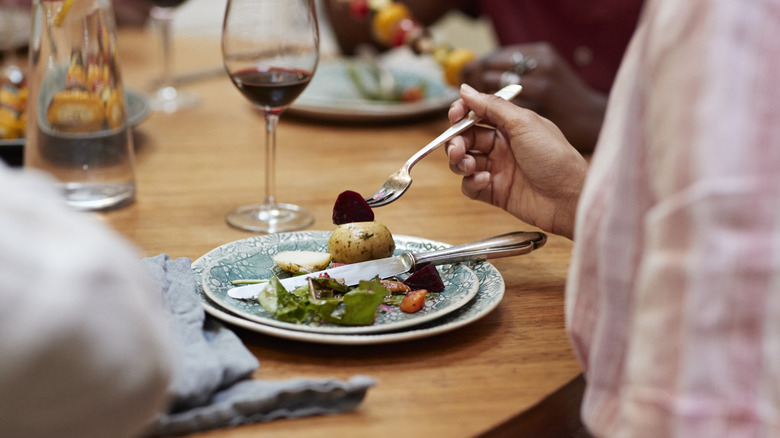 mid section of woman eating the American way