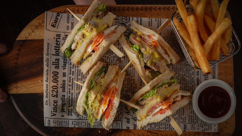 Top view of club sandwich and french fries