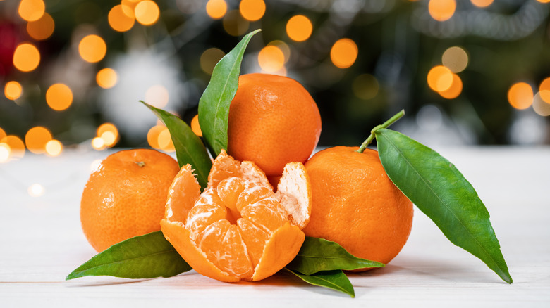 Peeled and whole tangerines
