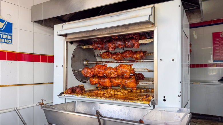 Chickens cooking in a rotisserie oven