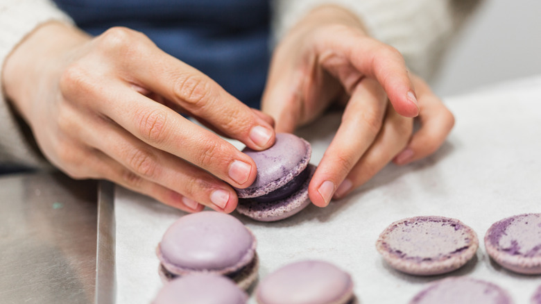 A baker making macarons.