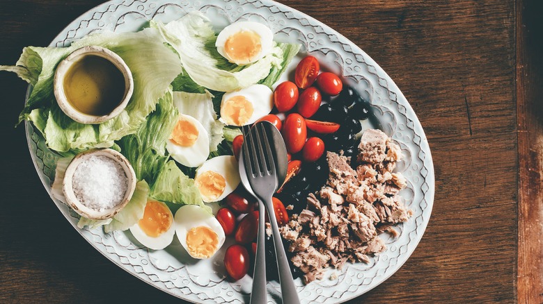 Nicoise salad on an ornate plate
