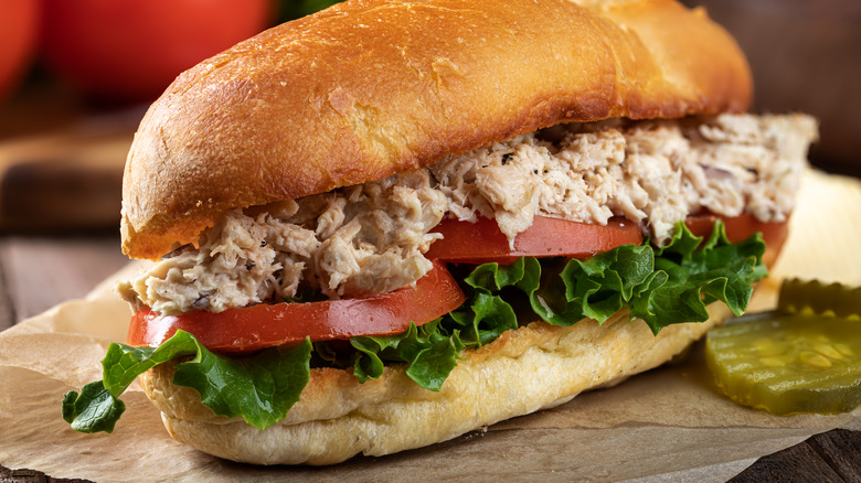 tuna salad sub with lettuce and tomato