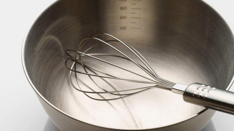 Mixing bowl with a whisk inside