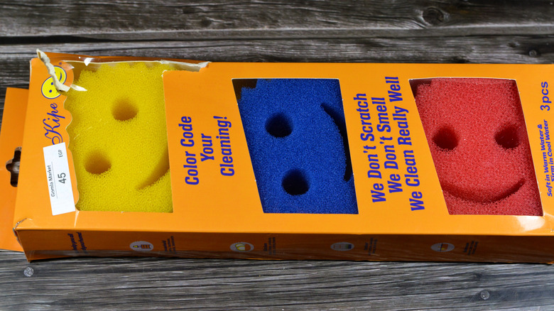 A package of fake Scrub Daddy sponges in yellow, blue, and red