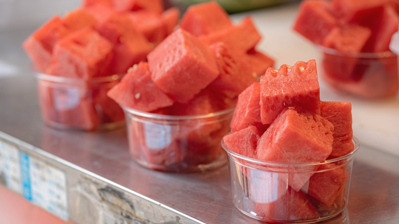 Plastic cups with cubed watermelon