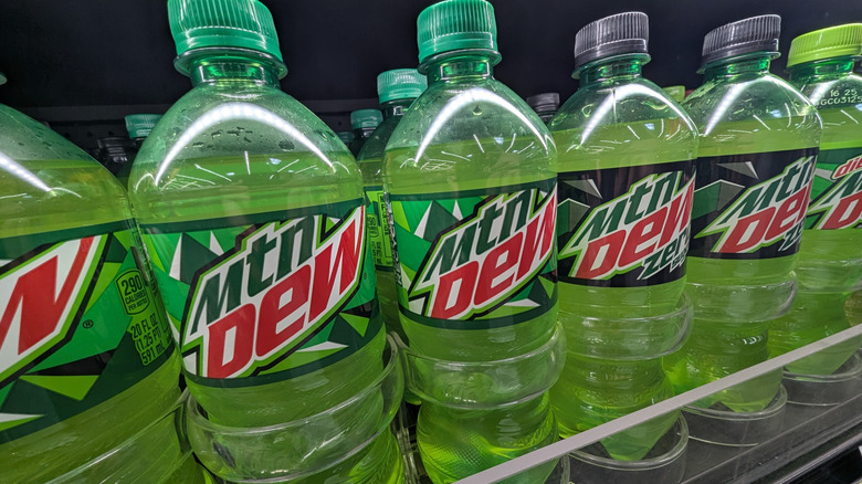 Bottles of Mountain Dew in a refrigerated display case