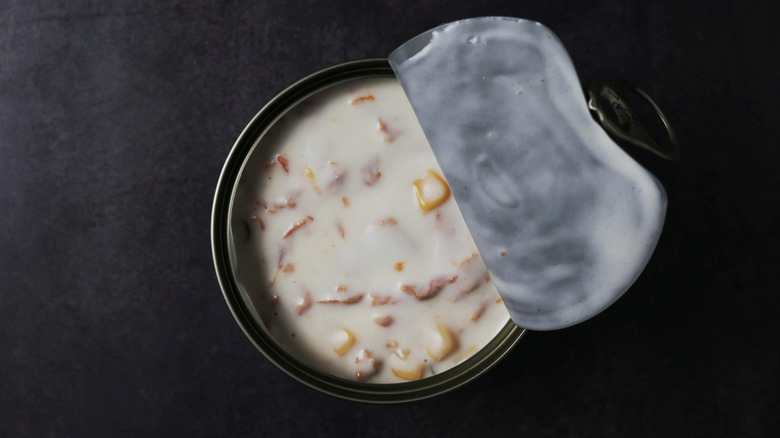 Top view of creamy canned soup with lid off