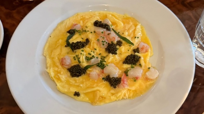Overhead of egg dish from Chez Fifi on white plate