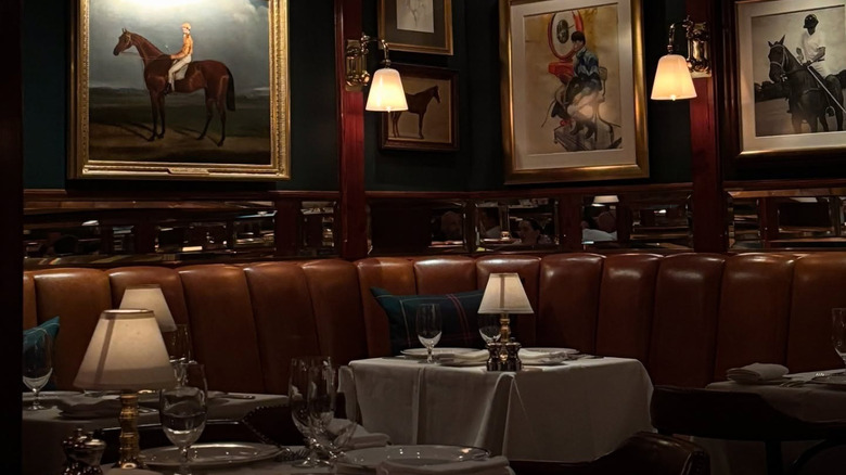low-lit interior of Polo Bar with horse artwork