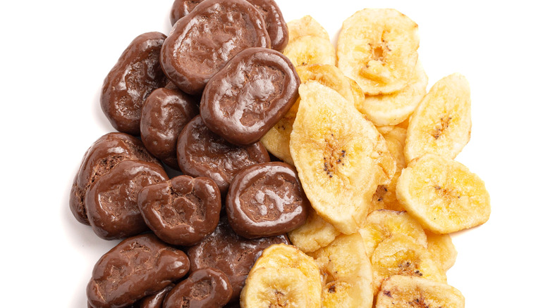 Chocolate-covered banana chips on a white background