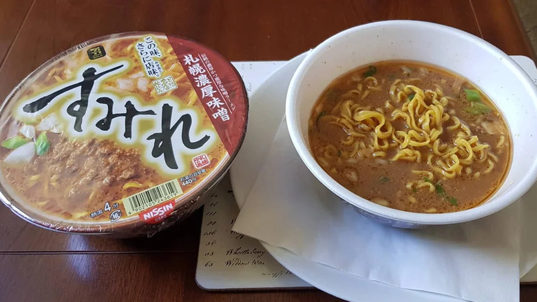 Bowl of Sumire miso ramen next to packaging on a table