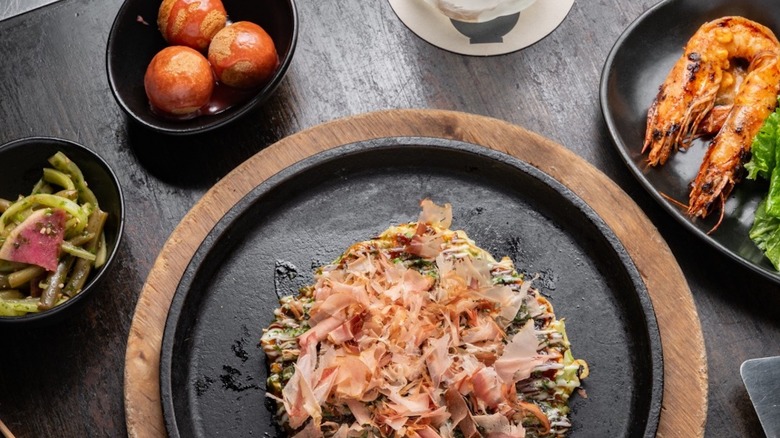 Donut holes, pickled vegetables, okonomiyaki, and grilled shrimp from Gaijin Chicago