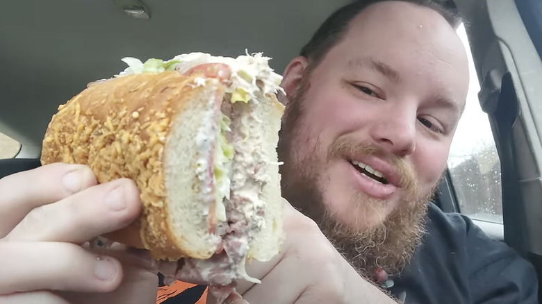 YouTube creator holding the Surf 'N' Turf sub