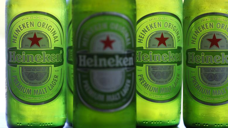 four bottles of Heineken beer