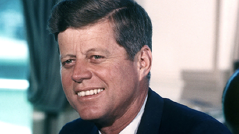President John F. Kennedy smiles for a portrait