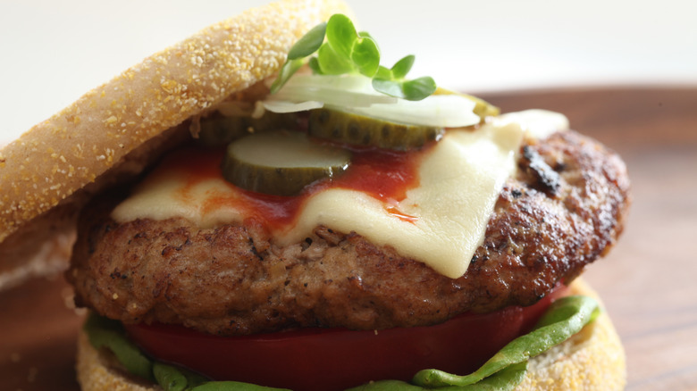 split english muffin cheeseburger with ketchup and pickle