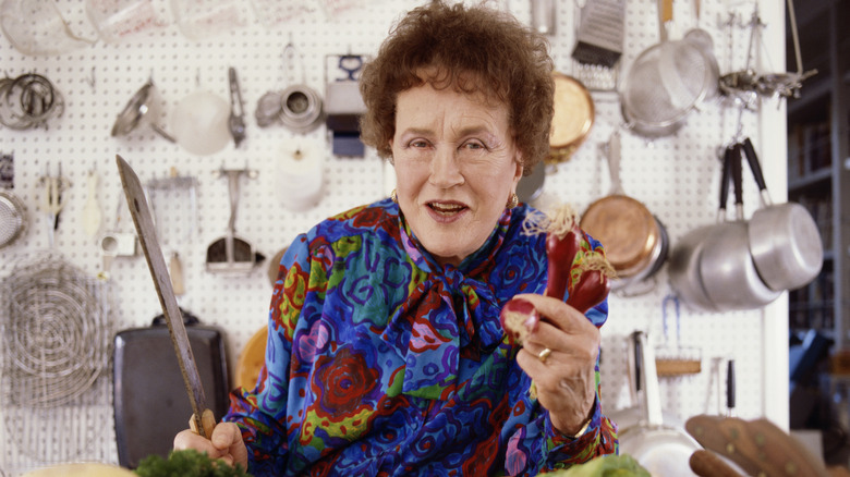 Julia Child photographed in her kitchen.