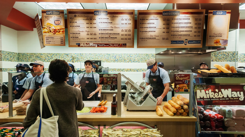 Employees behind counter at Jersey Mike's