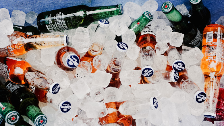 Bottled drinks in a container with bullet ice