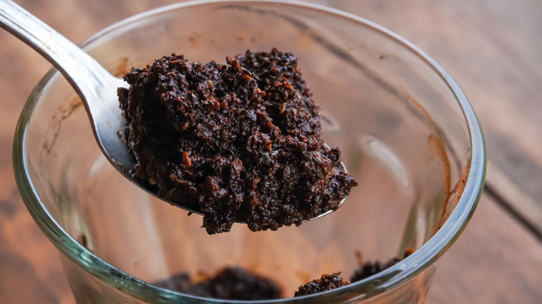 used coffee grounds in spoon