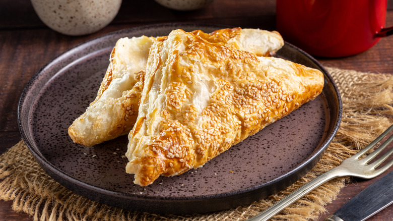 Golden puff pastry on a plate with a fork