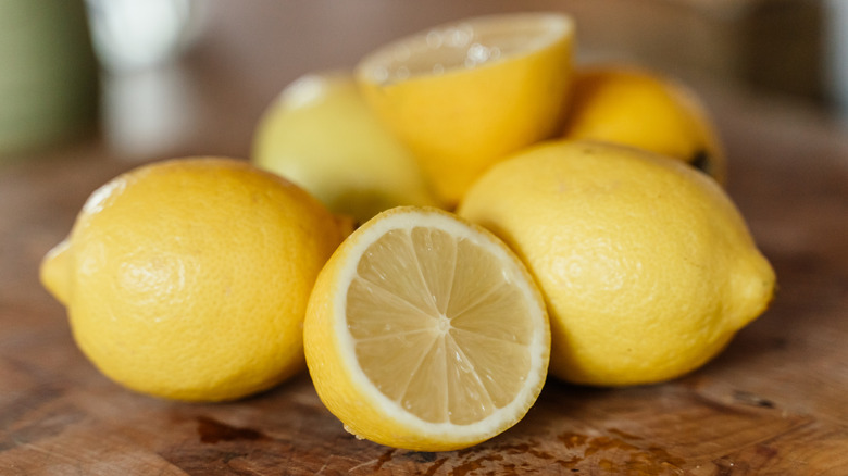 A pile of lemons on a table