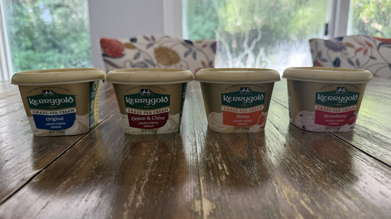 Kerrygold cream cheese tubs on wooden table