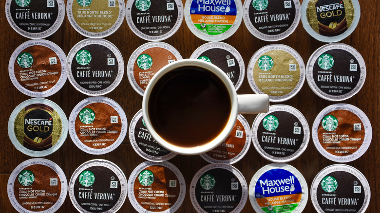 Cup of coffee and rows of K-Cups