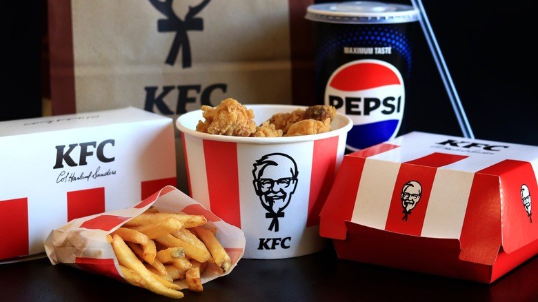 Food and a beverage from KFC on table