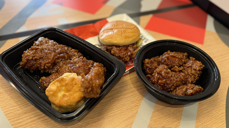 an array of KFC chicken items covered in Original Honey BBQ sauce
