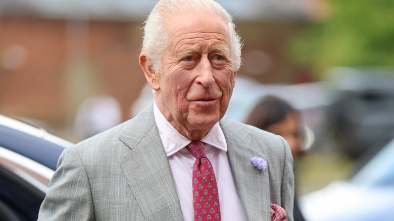 King Charles III makes a public appearance in a gray suit