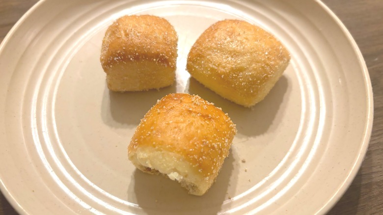 close up of three topped King's Hawaiian x Minions Shake 'Em Banana Bites on plate