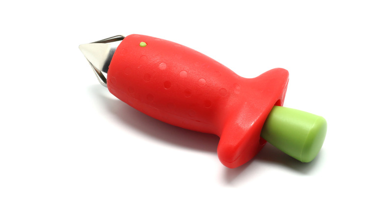 A red strawberry huller