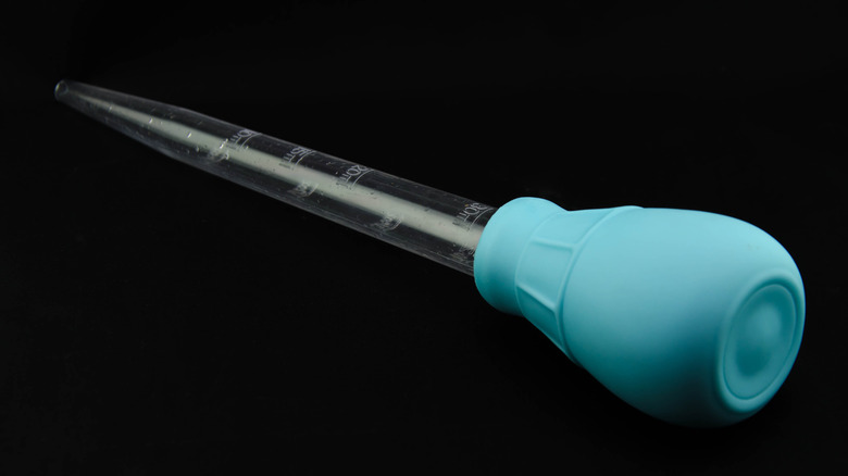 A light blue turkey baster