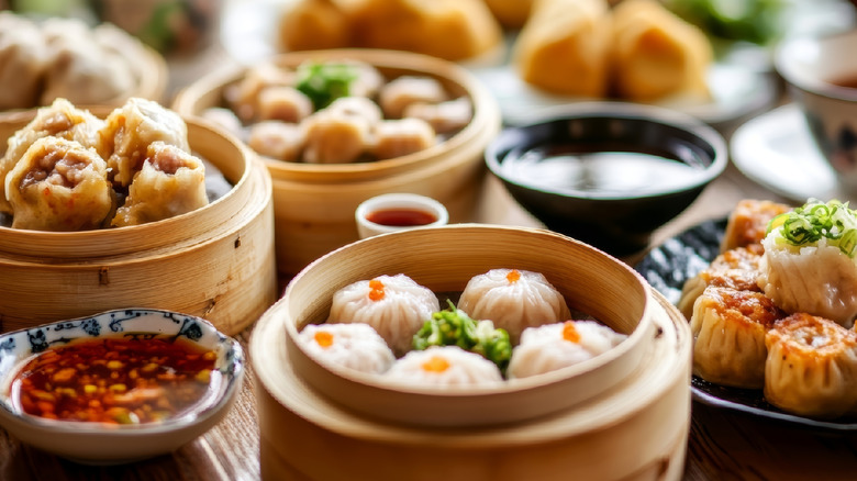 Dim sum dumplings with dipping sauces