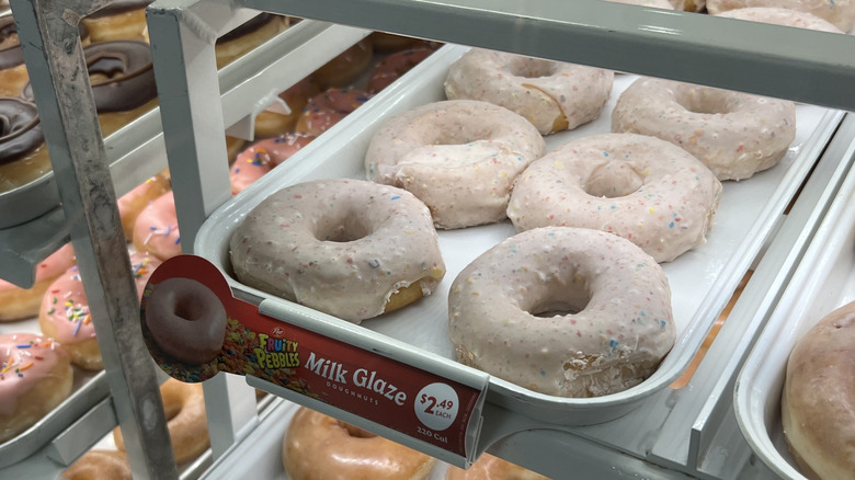 a tray of Krispy Kreme's Fruity Pebbles Milk Original Glazed Doughnuts