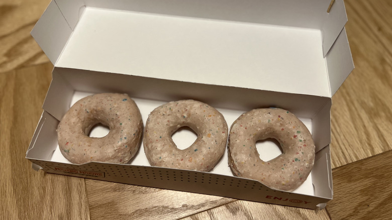 a 3-pack of Krispy Kreme's Fruity Pebbles Milk Original Glazed Doughnuts