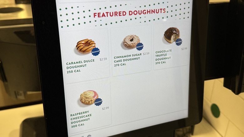 a Krispy Kreme kiosk with Winter Seasonal Doughnuts on screen