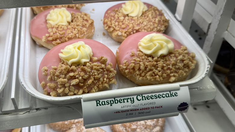 a rack of Raspberry Cheesecake Doughnuts