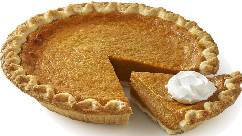 unwrapped Bakery Fresh Pumpkin Pie with one slice slightly separated from the rest of the pie