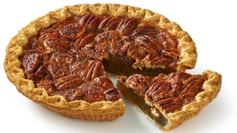unwrapped Bakery Fresh Pecan Pie with one slice slightly separated from the rest of the pie
