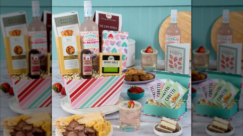 A gift basket spread from Gourmet Gift baskets featuring a charcuterie plate and margarita mix