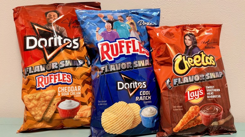A close-up of Lay's limited-edition Flavor Swap varieties, with a bag of Doritos, Ruffles, and Cheetos