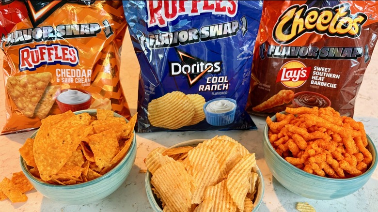 The 2026 Lay's Flavor Swap limited-edition varieties with the bags in front of bowls of the snacks on countertop