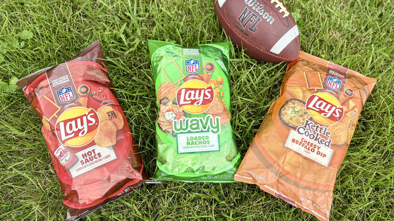 Lay's NFL limited edition flavors on a background of green grass