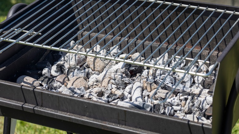 Charcoal grill with a lot of ash