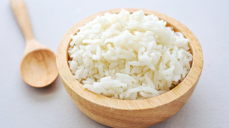 Steamed white rice in a wooden bowl