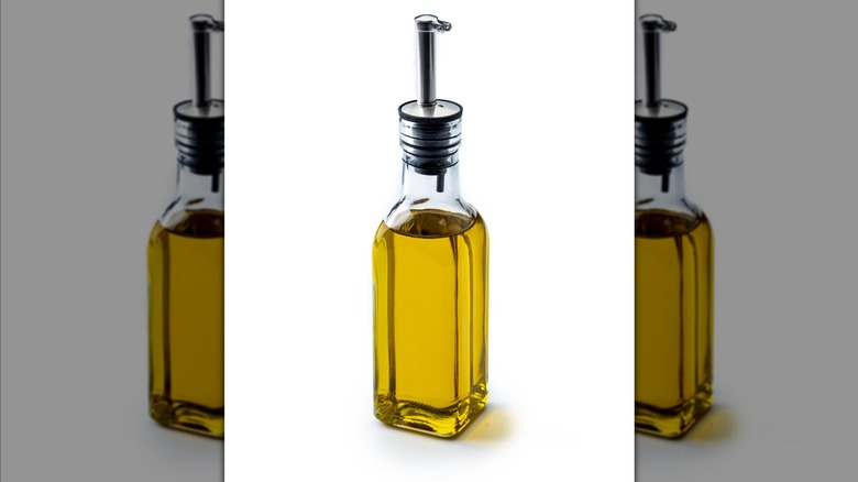 Bottle of olive oil on a white background