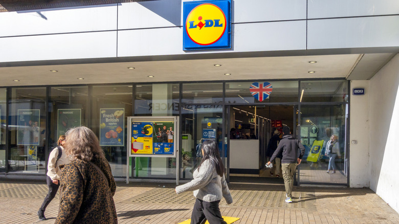 Exterior of a Lidl with people walking by